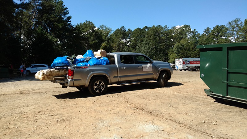Truck loaded down with trash after shore sweet