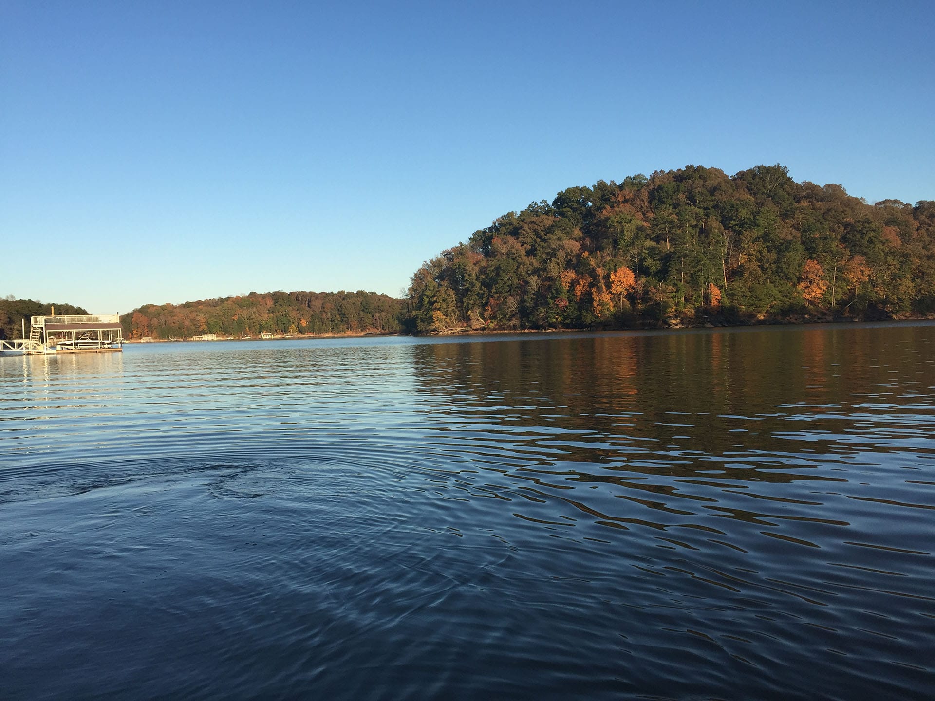 Lake Lanier with blue skies and a homeowner's dock